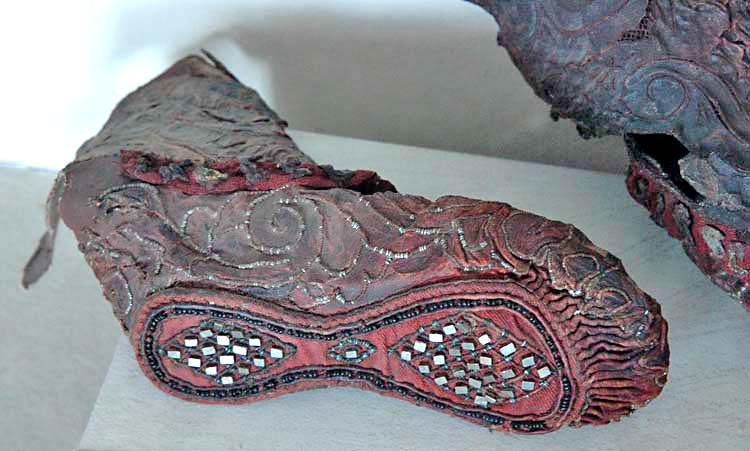 This beautifully detailed Scythian woman's boot is one of my absolute favorites! The frozen ground of the Altai Mountains preserved it for over 2,300 years. The leather boot was decorated with a red woollen braid, with leather figurines and gold-leaf, possibly depicting ducklings