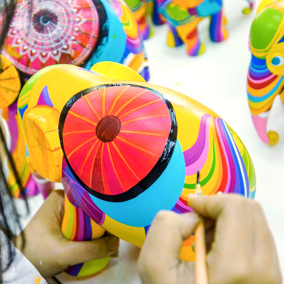 Replicas of elephant 'Colours of Chiang Mai' by Khunakorn Muenpang are being hand painted by one of our talented studio artists 🖌️⭐️ #SneakpeekSunday⁠ ⁠ #elephantparade #elephantstatue #handpainted #elephantparadefan⁠ #art⁠ #handcrafted #elephantlover