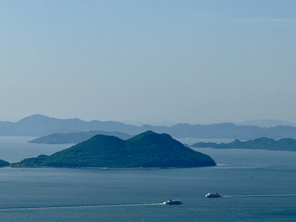 Two ferries crossing each other in the Seto Inland Sea near Takamatsu.