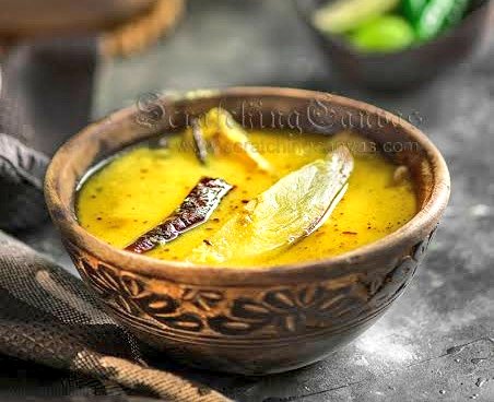 Tok Daal (Lentil soup with Raw Mangoes) One of the most popular bengali dish during the summers. The flavor & the taste of the soup is extremely delicious. It's easy to make and is served in Lunch. Cant ever imagine Summers without having Tok Daal. 😋 Pic via Google.