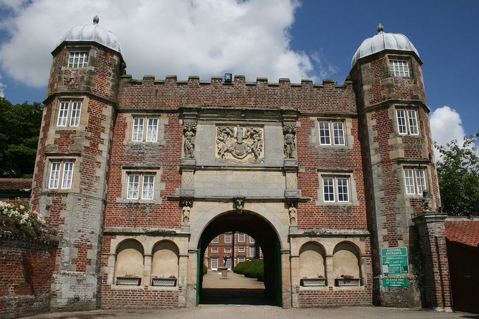 'We Enter under a Gate-house built wth 4 large towers into a Court which is large, in ye middle is a Bowling green palisado'd round and ye Coaches runns round it to the Entrance wch is by 10 stepps up to a Tarress, and thence a pav'd walke to ye house.'(Celia Fiennes 1697)