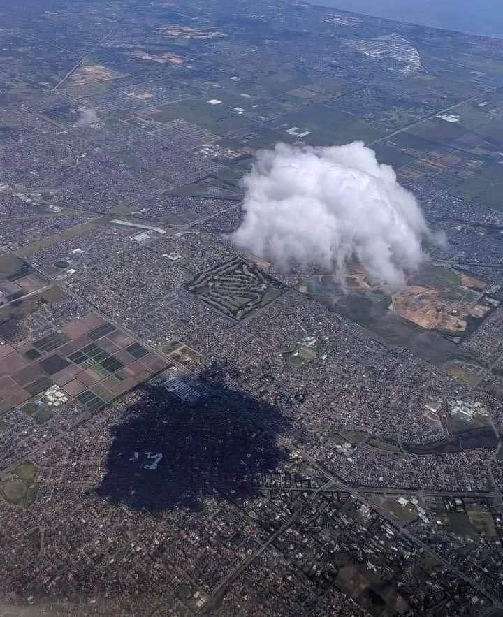 A Fluffy cumulus cloud and its shadow