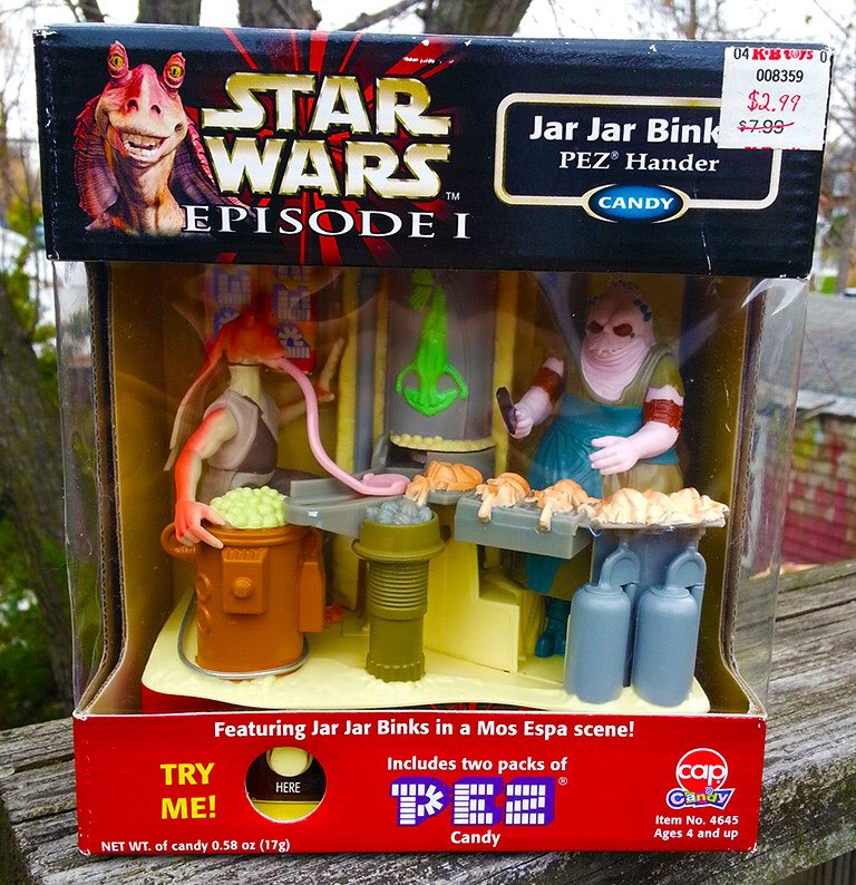 Happy 25th anniversary to The Phantom Menace... and to this motorized Pez machine based on the classic scene where Jar Jar swiped barbecued lizards from a demon-eyed street vendor.