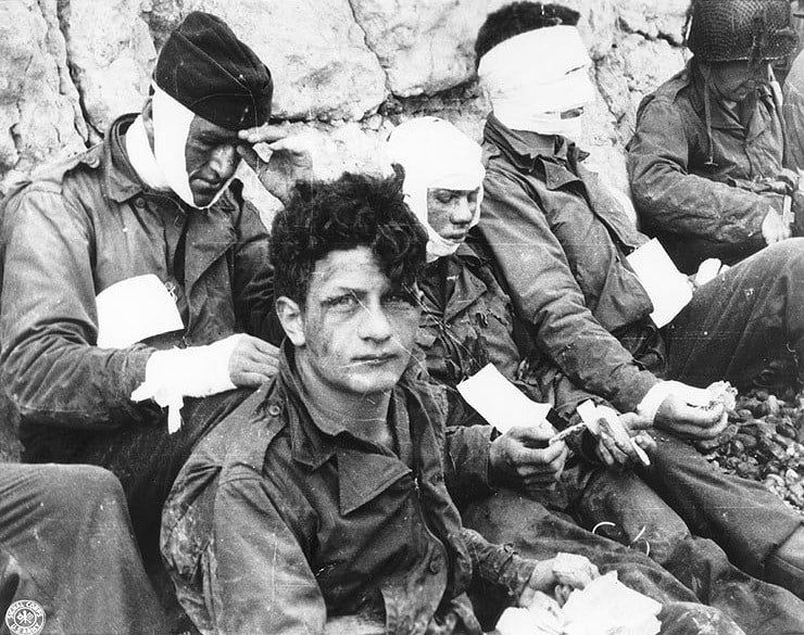 Wounded soldiers after storming Omaha Beach on D-Day, June 6, 1944.