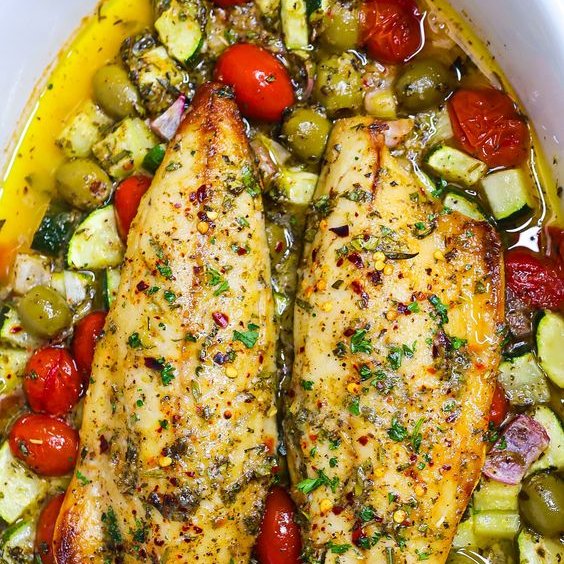 Easy Mediterranean Baked fish This Easy Mediterranean Oven Baked Fish is juicy and tasty, with deep fresh herbs, lemon, and garlic flavours