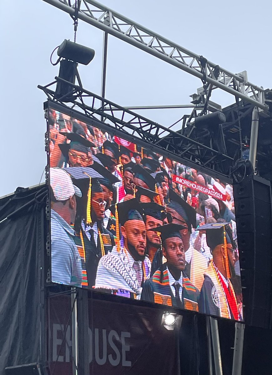 Several students and faculty are wearing Keffiyeh scarves at the @Morehouse College graduation.