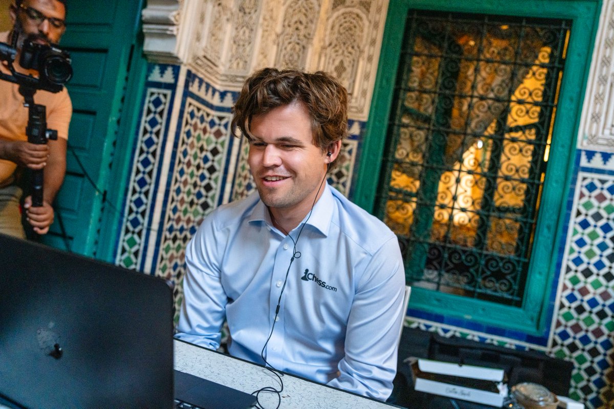 Magnus Carlsen is surely having a great time in Casablanca, Morocco! He is playing the Casablanca Variant, where you are given the moves from a famous game and you reach an opening position that is round about balanced with possibilities for both sides. Magnus started the day