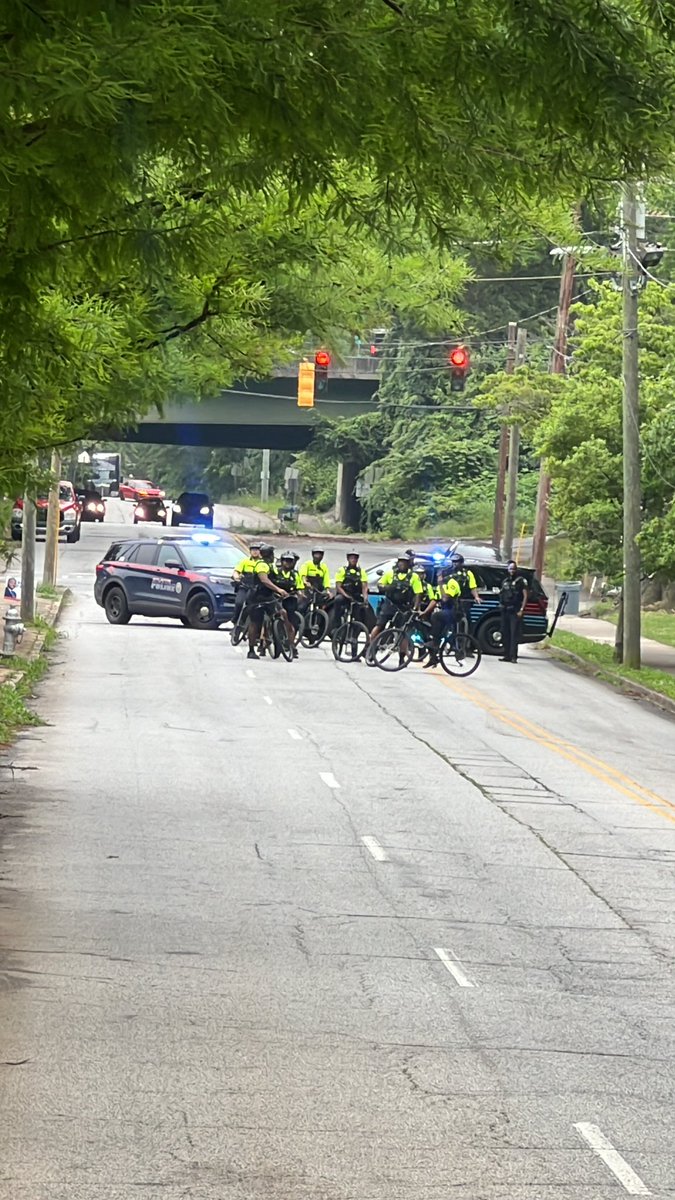 BrittanyEdney's tweet photo. APD squad cars &amp; bicycle units are now blocking off the end of Lucile Ave. it’s 2 blocks down from where #FREEPALESTİNE protesters are rallying. It’s also the route to Morehouse college which is .3 miles away. @FOX5Atlanta https://t.co/lMGN5lu38g