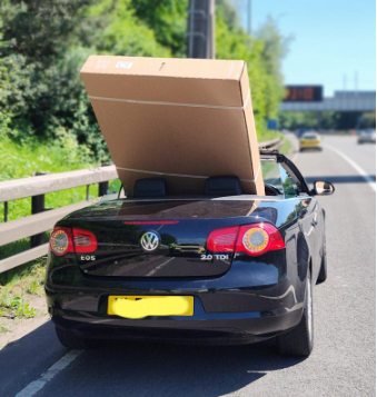 The driver of this vehicle didn’t want to pay for delivery so tried to transport his new 60” television home himself #M60. Apparently, there wasn't anything dangerous about his load carried because he 'had hold of it'. #PG9 issued, load removed & driver reported @NWmwaypolice