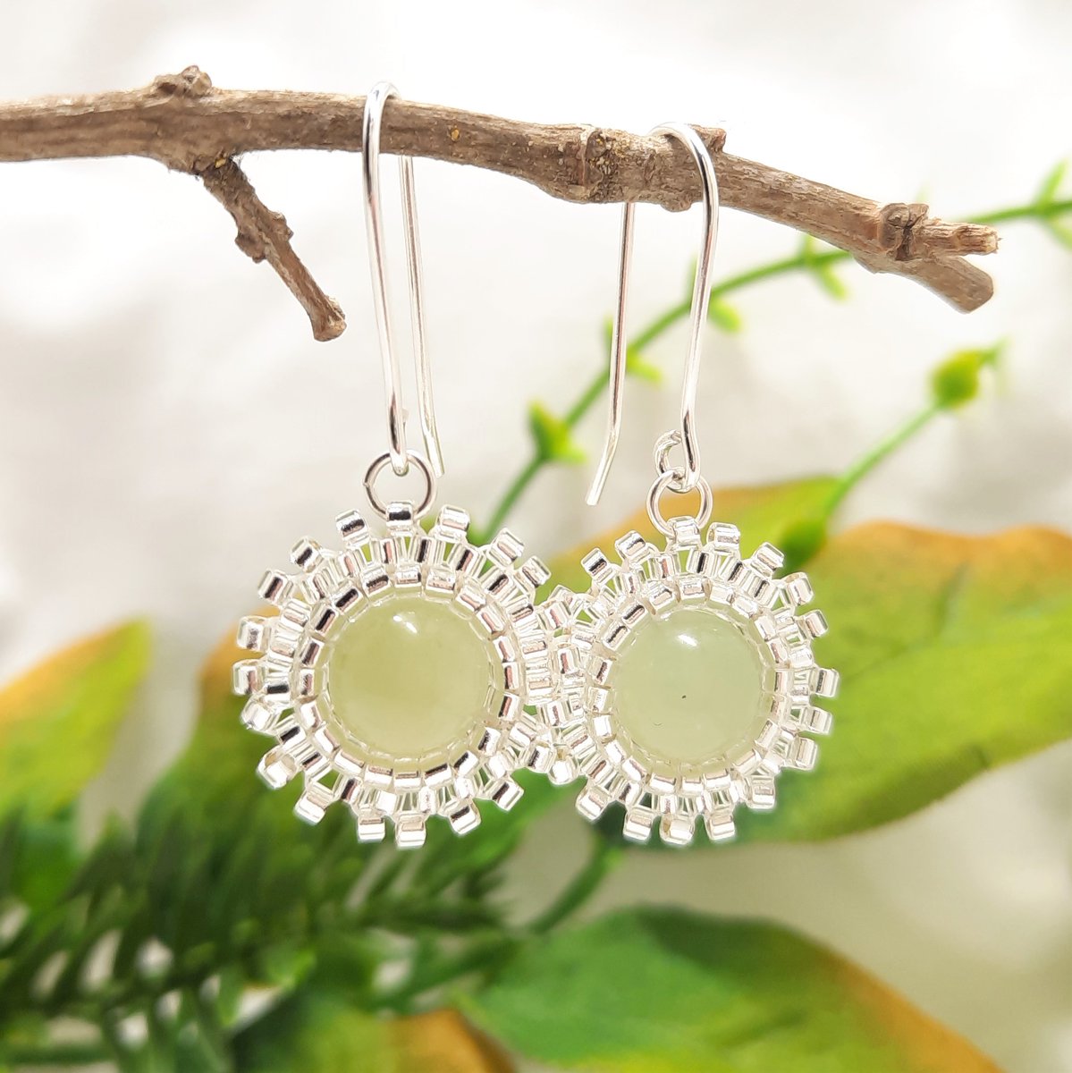 Now these are pretty earrings. Once again the colour of the jade is a delicate shade of green. They have silver glass bead bezels woven about their diameter so that you can see the jade on both sides cherylsjewellery.etsy.com/uk/listing/112… #mhhsbd #earlybiz #jade