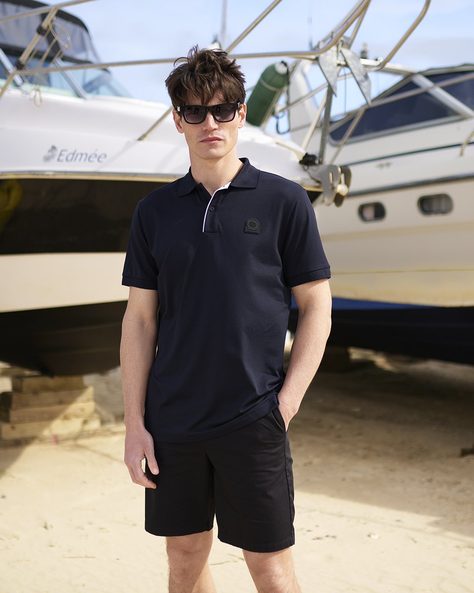 Experience a touch of sophistication with our Men's Sandbanks Black Polo Shirt. Featuring a contrast stripe placket, this shirt exudes exclusivity and style. Crafted with the finest materials, it offers both comfort and elegance. ✨👕 - Shop Now odsdesignerclothing.com/collections/me…