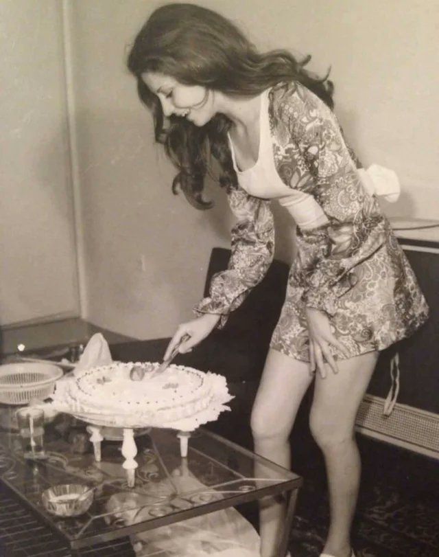 17. A woman cuts her birthday cake in Iran, 1973