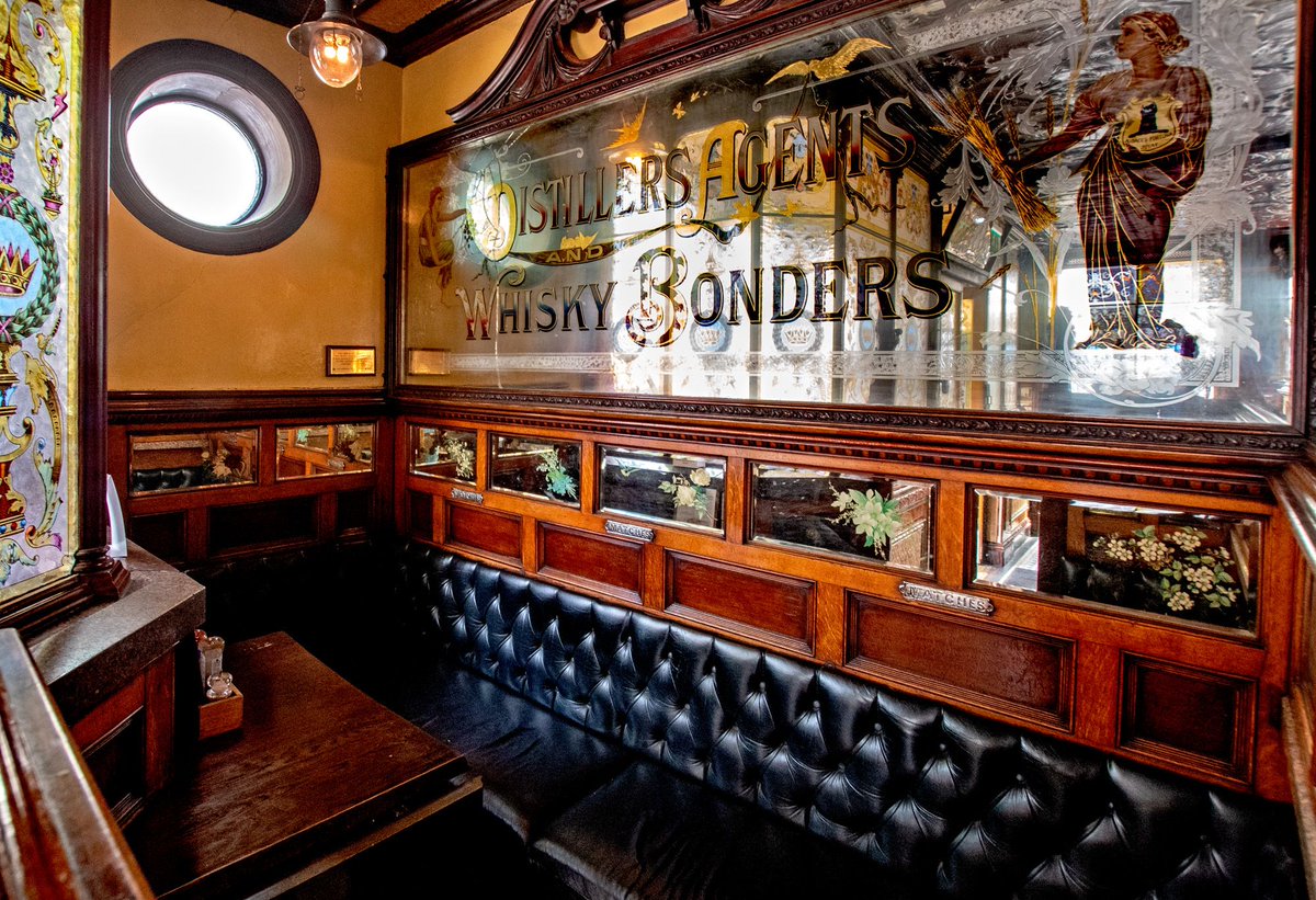 The breathtaking Crown Bar in Belfast. Magnificent ceramic bar counter by Craven Dunnill along one side, a row of 8 ornate wooden booths with stained glass and mirrors along the other side. 8 bay bar back with whisky barrels and original spirit cocks. 5 real ales & 1 real cider.