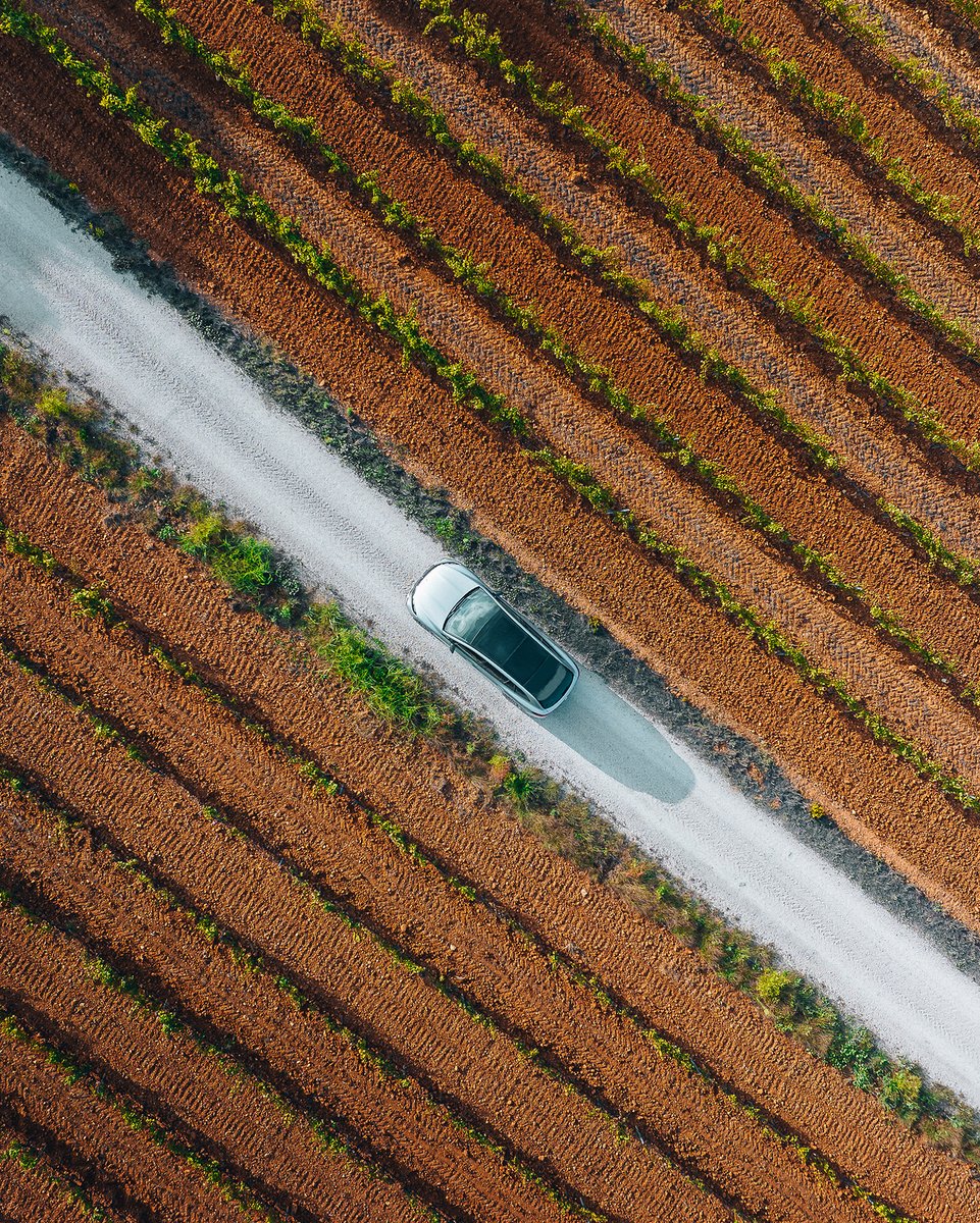 Experience the freedom of the open road with the EQS SUV. This stunning aerial shot captures the vehicle's power and beauty in the midst of nature's beauty. Take a deep breath and enjoy the ride. 📷 withluke (IG) #MercedesBenz #EQSSUV