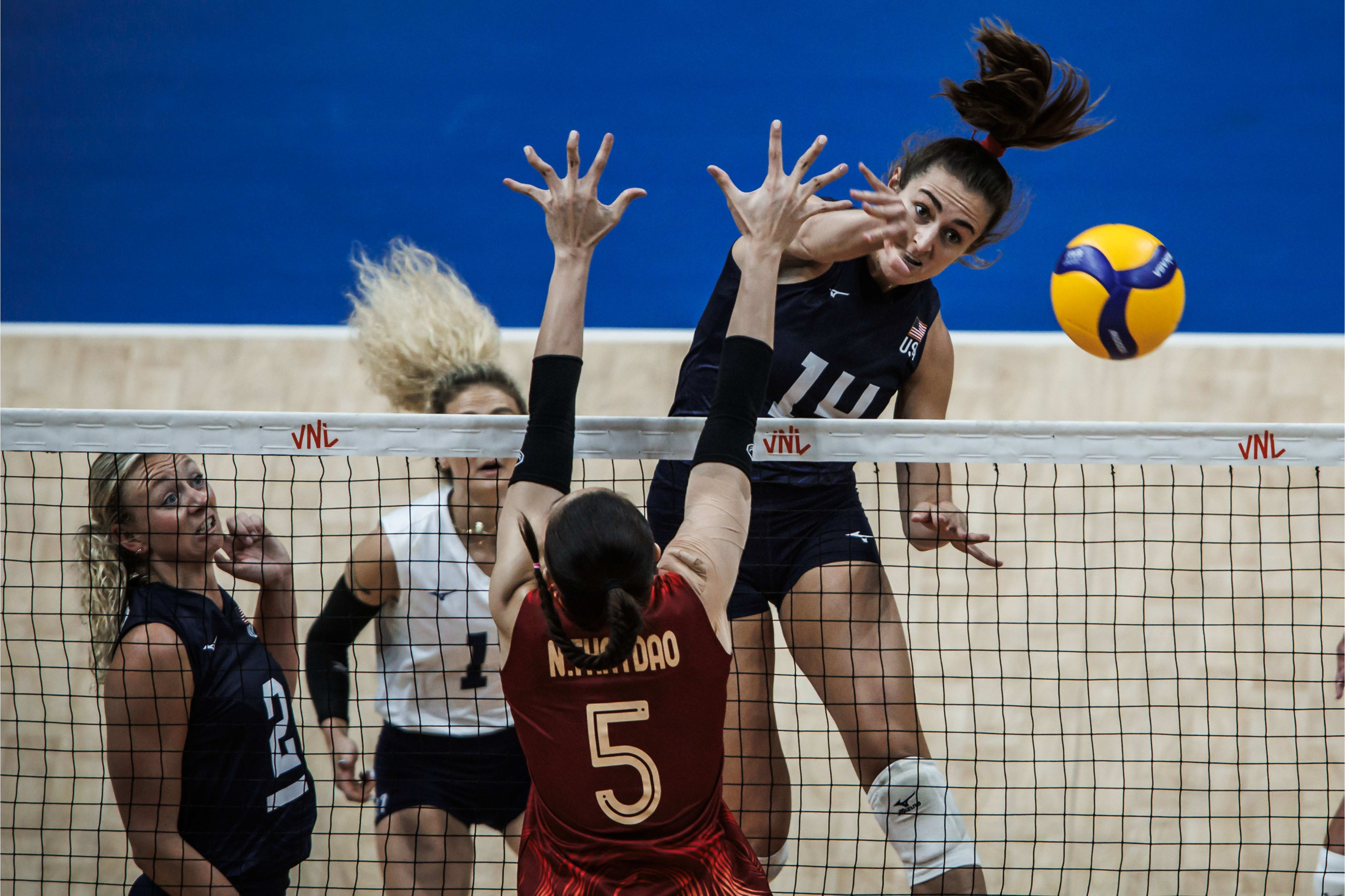 A U.S. Women's volleyball player attacks the ball