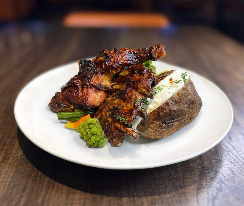 Dig into our mouthwatering Tap 25 BBQ Chicken & Ribs special for only $9.99! BBQ chicken leg, 1/3 rack of tender BBQ ribs, served with a delicious baked potato, and chef-selected veggies. 😋 🔥 Available Sundays from 5:00-10:30pm! 18+ dining