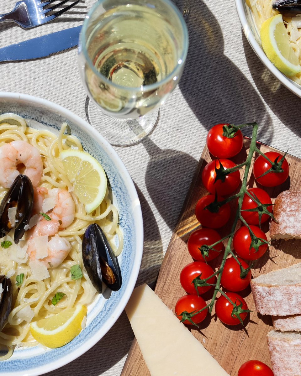 Dining al fresco with seafood pasta in a white wine sauce 🍝🥂