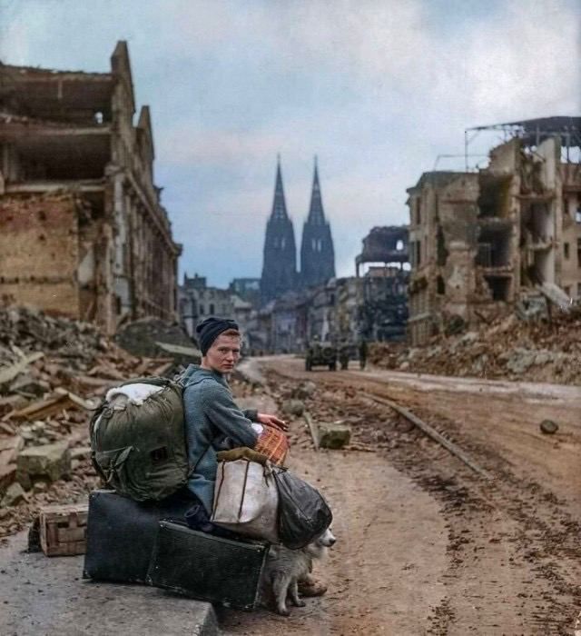 A German woman with all her belongings sits alone in war-torn Cologne, 1945. 

#WWII #Cologne1945 #GermanHistory #WarTorn #AftermathOfWar #History #1945 #HumanResilience #PostWarGermany