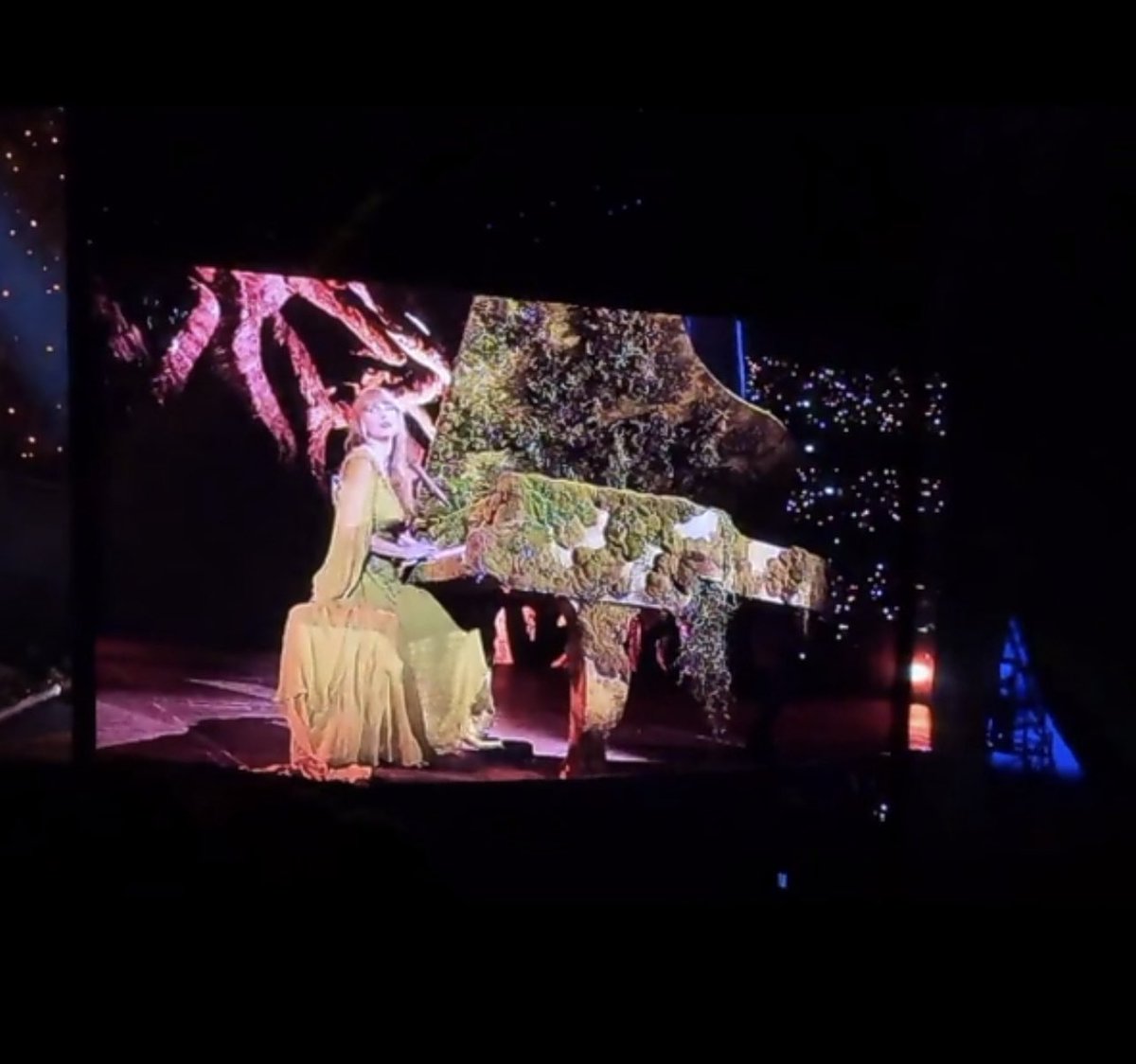 wow the green dress with the piano is everything
