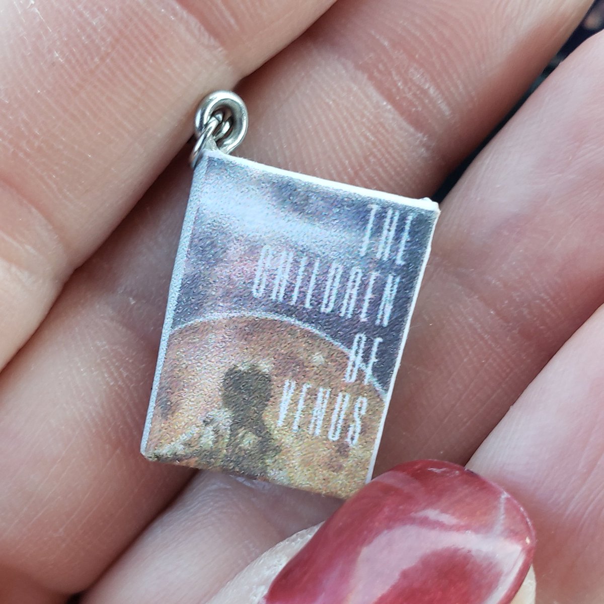 A gift from my husband--book earrings depicting my debut novel. He's so sweet! I'll be wearing these to all future events.
#thechildrenofvenus #theconquerorsoftriton #booksigning #debutnovel #amwritingscifi #writingcommunity