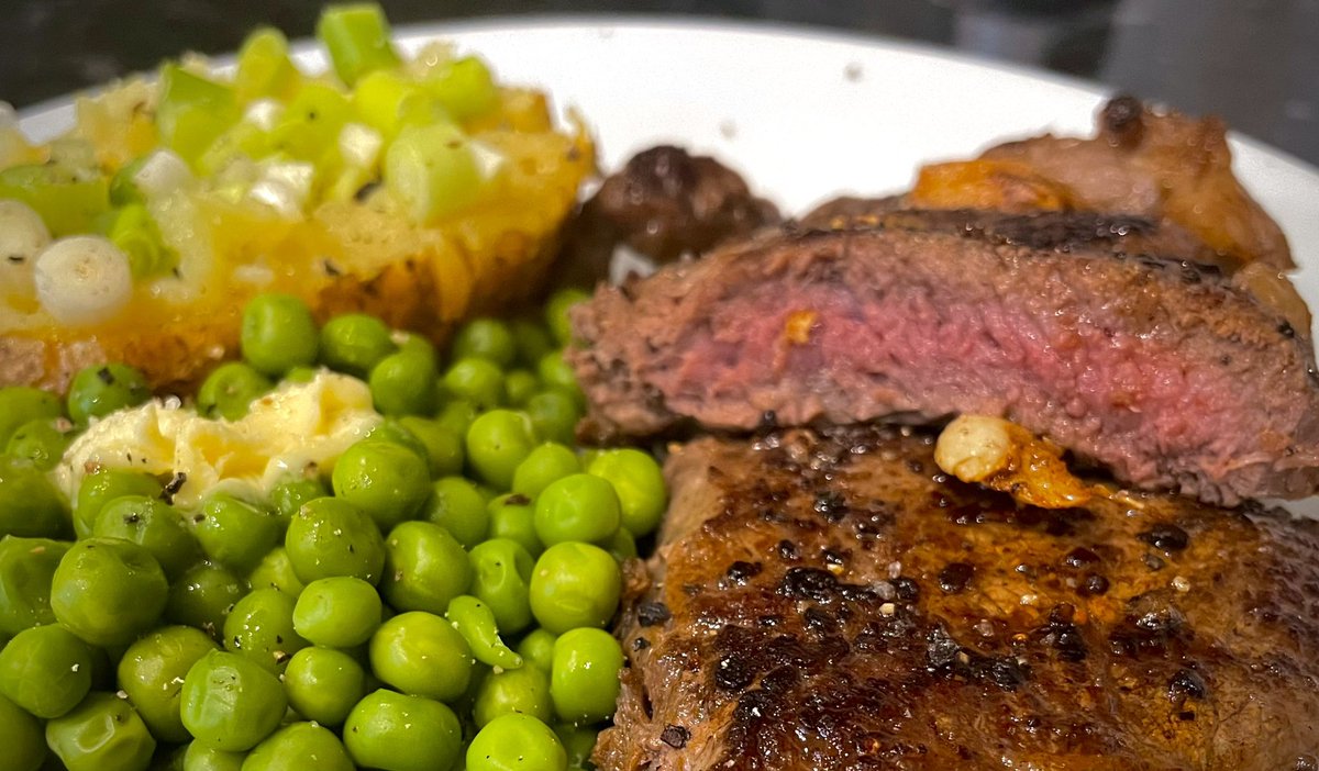 Sirloin, jacket potato with spring onion and butter with peas… An overcook of maybe 30 seconds on the steak too..
