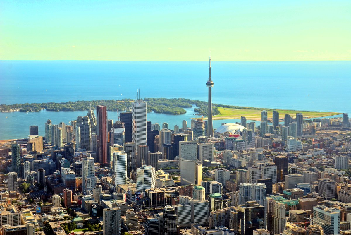 AERIAL VIEW OF DOWNTOWN TORONTO, WITH A VIEW OF TORONTO ISLANDS AND LAKE ONTARIO IN THE BACKGROUND
By Taxiarchos228 - modified by Floydian CC BY-SA 3.0,
(tinyurl.com/5n8z84uv)
#downtowntoronto #toronto #gta #tdot #streetsoftoronto #lovetoronto #cntower #torontophoto