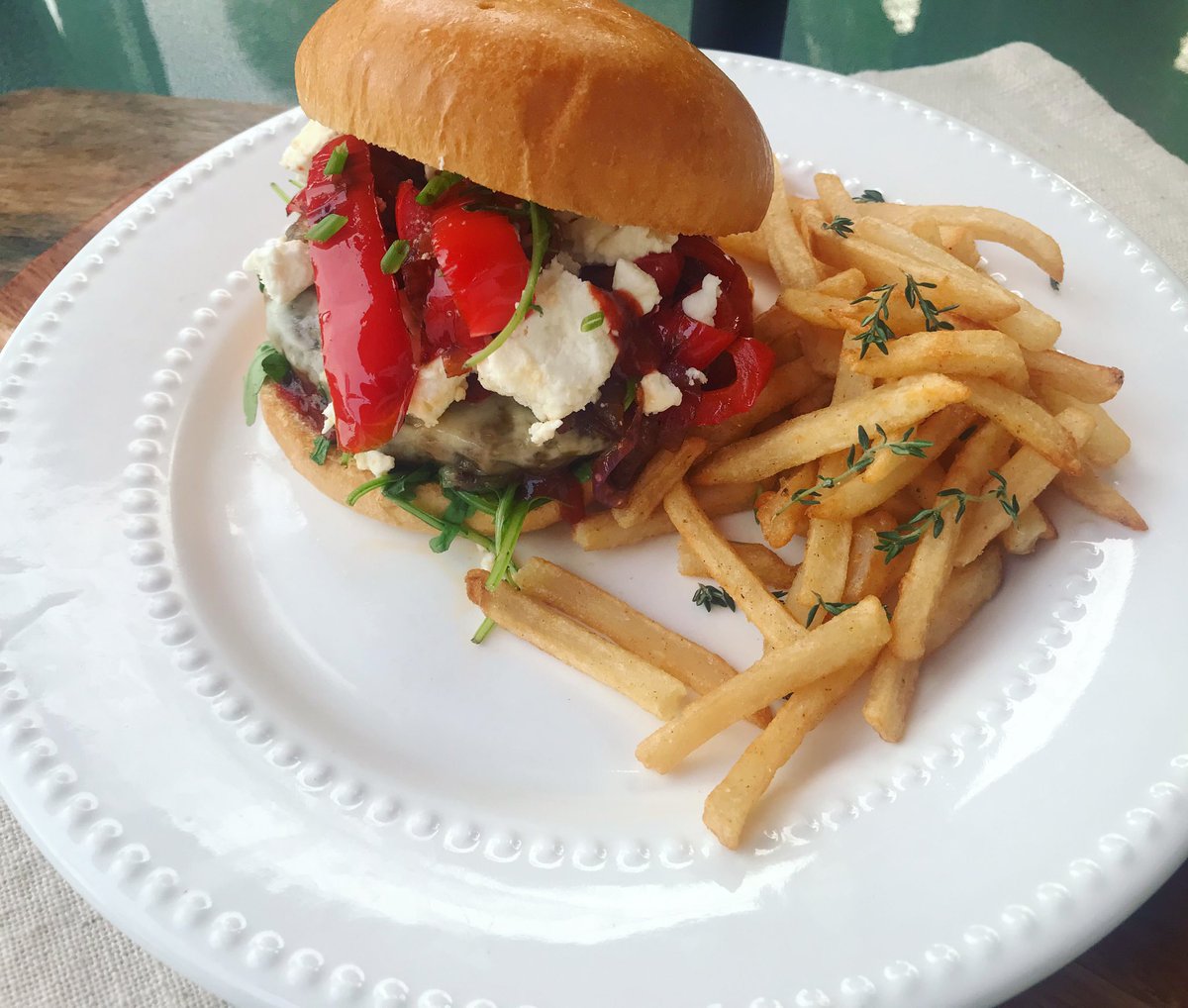 The Pepper 🌶️ Feta Burger 😋🌿sautéed red peppers 🌶️ red onions , melted pepper Jack cheese ,topped with feta cheese on a toasted Brioche bun with arugula & sriracha sauce 😋