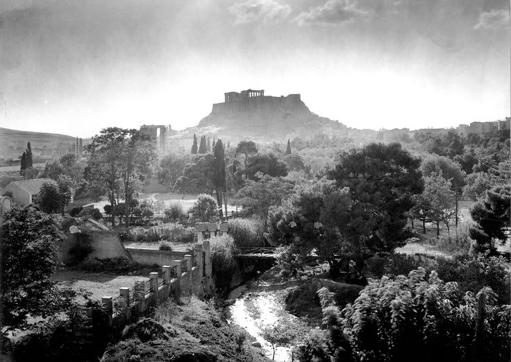 This is an early XX century photo of Athens with the Acropolis in the distance taken by Frédéric Boissonnas, and yet there's a sense of timelessness captured in the sot light of day.