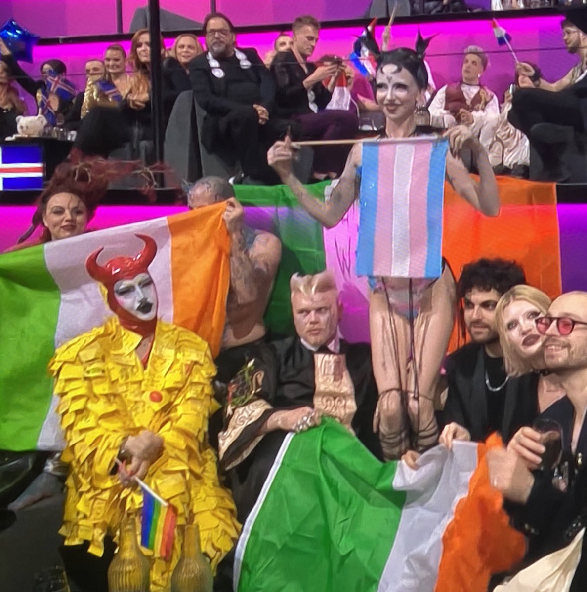 Why is the Irish entry to #Eurovision holding a 'Trans' flag advocating the sexual mutilation & lifelong sterilisation of children? Ireland can do better than grotesque weirdos. People with the mental illness of gender dysphoria need psychological help, not physical castration