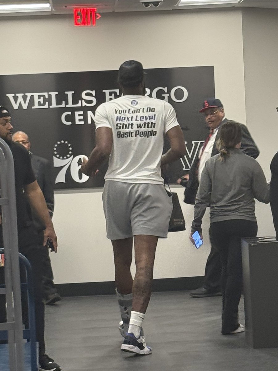 my enduring image of mitchell robinson in the 2024 playoffs: leaving wells fargo center after game 6 in a walking boot and a shirt that says “you can’t do next level shit with basic people”