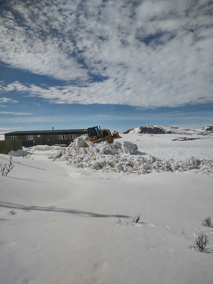 Still alot of snow to move up at Toolik Field Station in order to welcome the researchers who are migrating north along with the birds. 
Joe is knocking down this pile to make room for more snow piles. The dozer might look small in the photo but it is a large normal sized dozer.