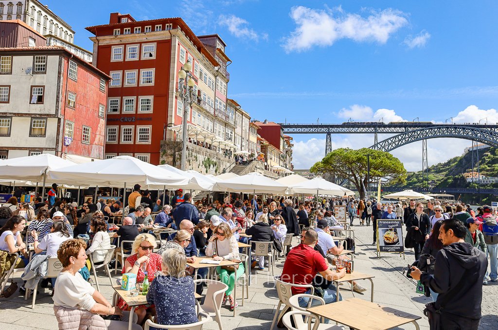 The vibrant Cais da Ribeira - the Ribeira Waterfront. In the background you can see the Metro train sharing the upper deck with the pedestrians on the iconic Dom Kuis I Bridge. More on that later.

#Portugal #Porto #DomLuisBridge #gourmetflyer