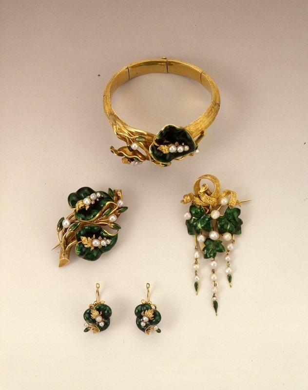 Paris.

Beautiful Parure, 1852-70.

Gold, translucent enamel on guilloche background, pearls in the form of branches and leaves.

©️ @madparisfr 
#Jewellery
