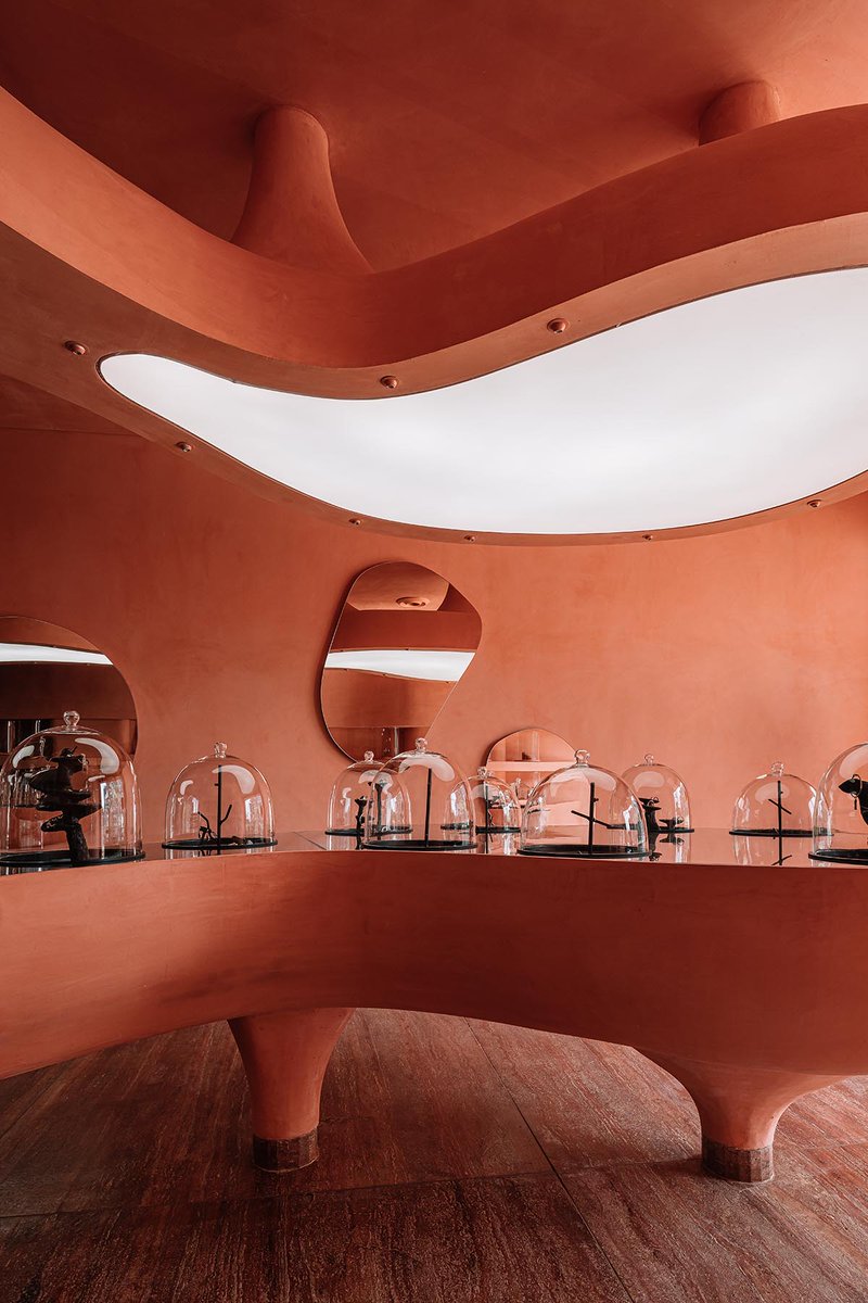 Indian jewellery boutique by MuseLAB features terracotta-doused interiors creating a sinuous island: worldarchitecture.org/architecture-n… #interiordesign