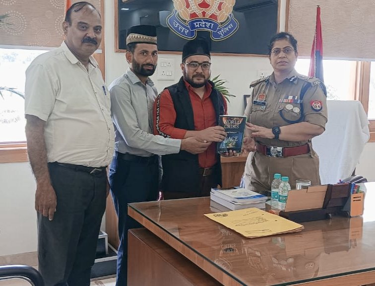 #Ahmadiyya Muslim representatives presenting the book 'World Crisis and the Pathway to Peace' to Ms Anupam Kulshrestha, Additional Director General of Police, #Agra Zone, UP