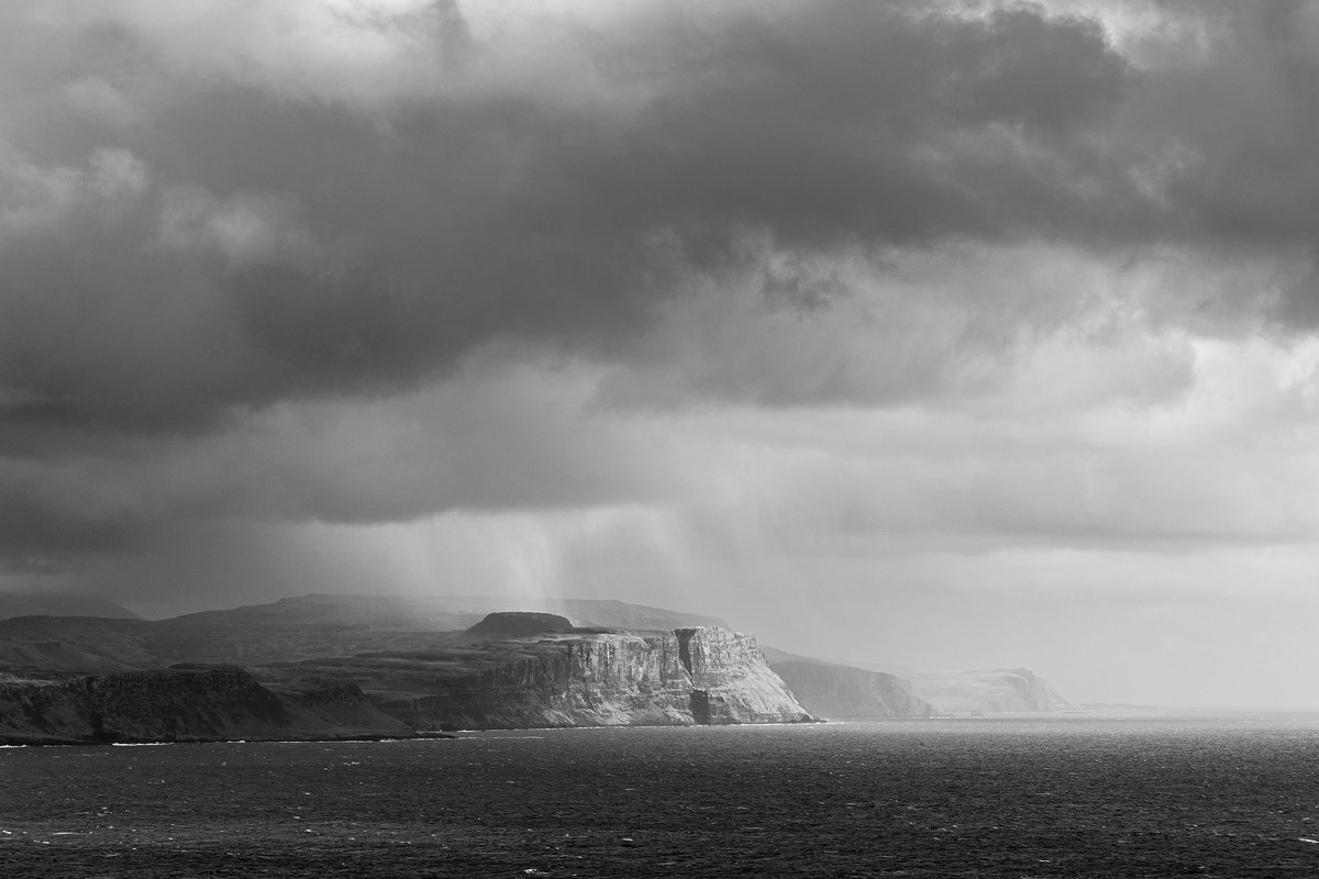 A rain shower passes through Talisker Bay, #isleofskye #scotland
