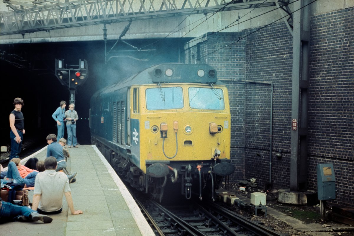This week's #WaybackWednesday find from the loft - Birmingham New St, Saturday 14th August 1982 and somewhere in that cloud of clag the spotters are admiring 50019 Ramilles, coming out of the engine bay at the end of P12 to take over 1V88, the 1120 Liverpool Lime St - Paddington.