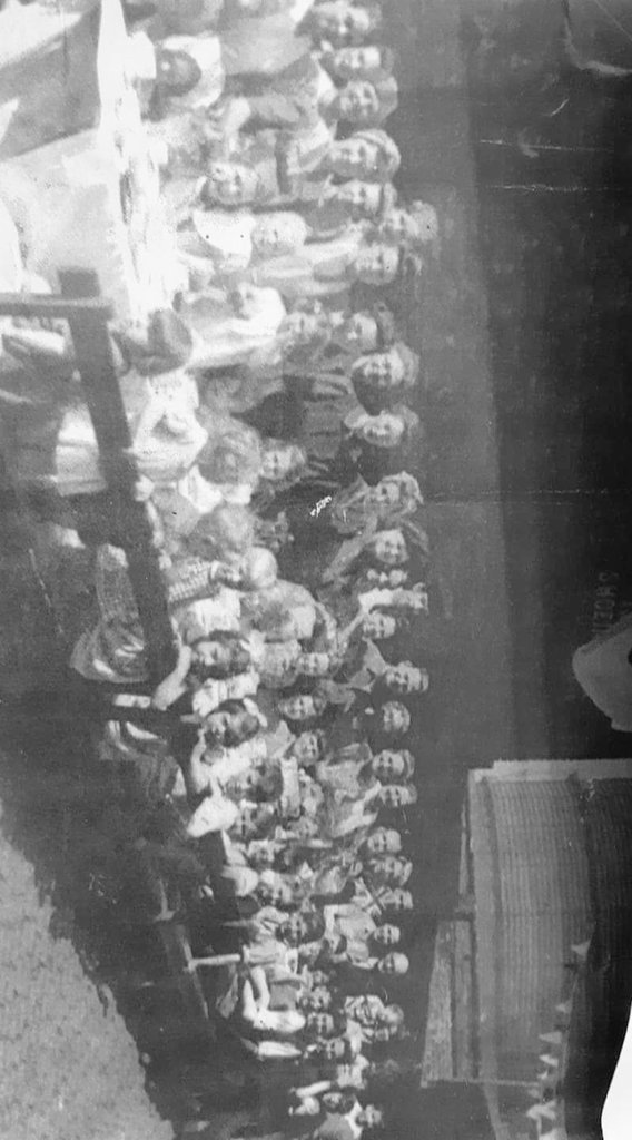 @GroomB VE Day street party in Ancoats. They all clubbed together to make jam butties for the kids. My grandma is the little girl sat in the middle with a bow in her hair next to her sister ❤️