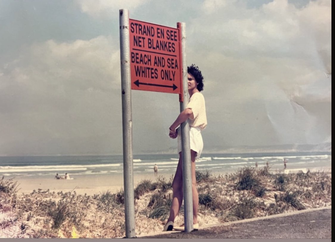 A reminder that Apartheid was not that long again. My dad took this photo of my mom at a whites only beach and as a coloured person she was scared to even stand this close