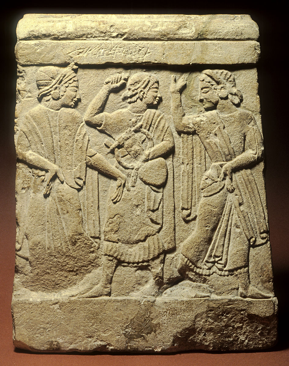 #ReliefWednesday On this relief from a funerary cippus a man holding a lyre stands between two dancing women. Such pyramidal monuments are typical of the region around Chiusi and depict the dances that took place during the ritual funerary banquet. (See Alt.) #Art #History 👀