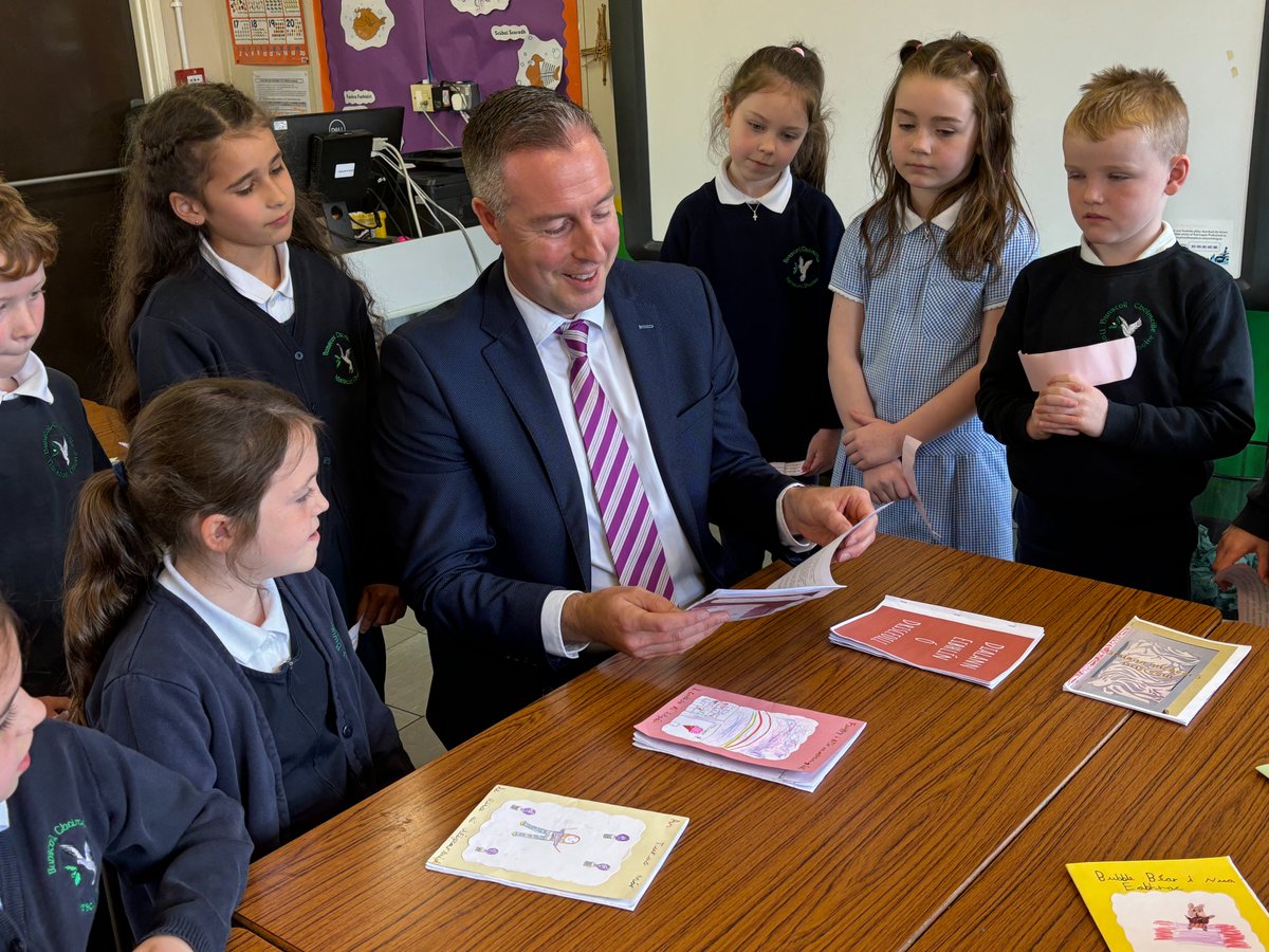 Education_NI's tweet image. Education Minister @paulgivan was delighted to meet staff and pupils at Bunscoil Cholmcille when he joined them to help mark the school's 40th anniversary. 

The Minister heard about the success of the school's football team and helped out in the outdoor garden before chatting to…