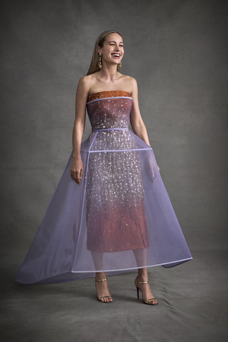 A dreamy Prada ensemble worn by Brie Larson makes a gradient with crystals and a crinoline dress for the 2024 Met Gala, theme: The Garden of Time. #PradaPeople #BrieLarson #MetGala