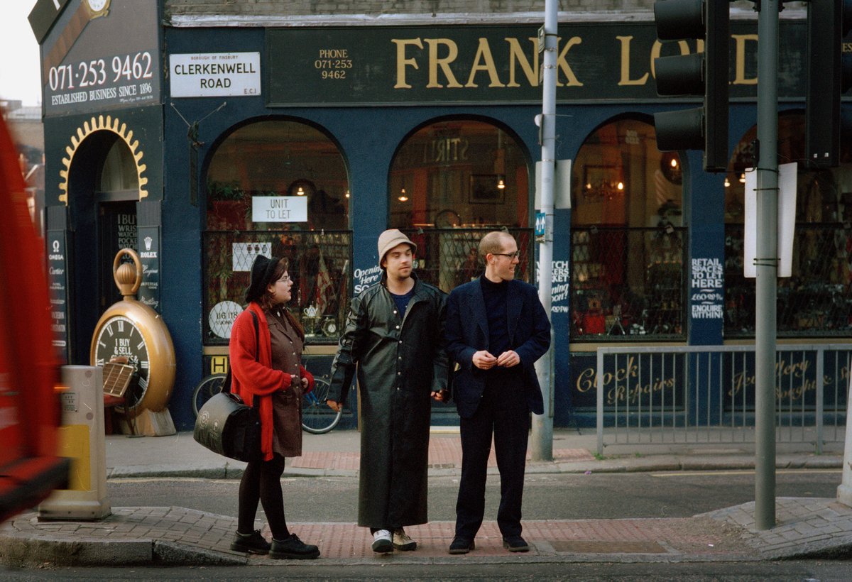 Clerkenwell 1997. With <a href="/caitlinmoran/">Caitlin Moran</a> and <a href="/robbiewilliams/">Robbie Williams</a>  (who interviewed him for Select) on our way to Farringdon Tube where we photographed on the Circle Line. Our latest video 😉youtu.be/p0C3NCqd-qI?si…