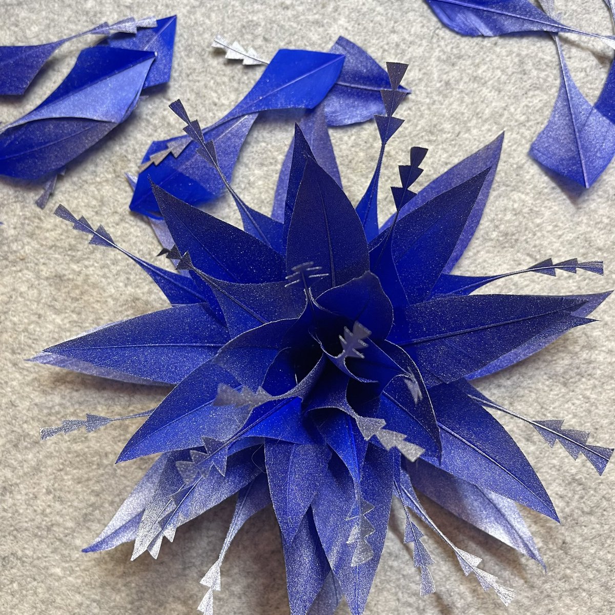 Creating royal blue feather piece to match an outfit. The frosty look makes it pop even more! #blue #royalblue #matchingaccessories #weddingflowers #weddingstyling #wedding #styling #pictureperfect