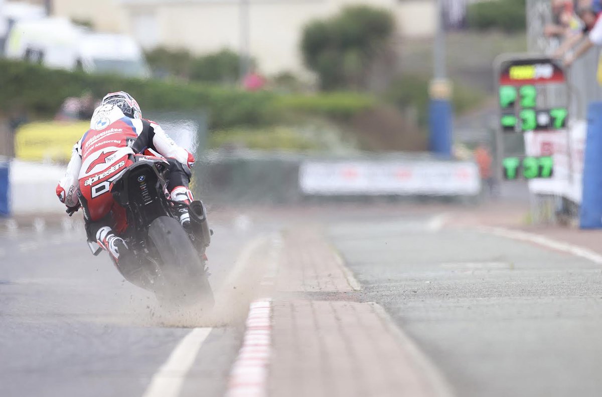 northwest200's tweet photo. Davey Todd kicks up the dirt on his Milwaukee BMW at the exit of the start / finish chicane on his way to setting the 2nd fastest time in todayโs Superbike session at the Briggs Equipment North West 200.
@DaveyTodd74
@briggs_niroi
@TASRacing_NI
@MilwaukeeTool https://t.co/cddPzoEQQd