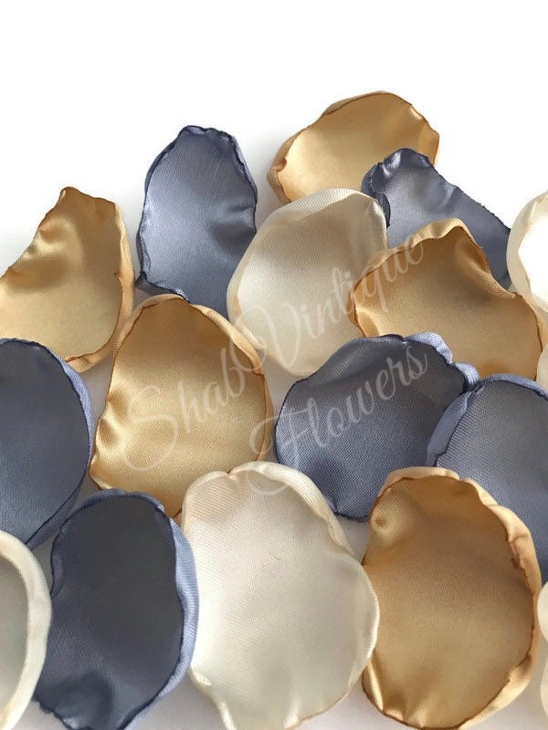 Drift down the aisle on a sea of enchantment with our Dusty Blue, Ivory & Gold Flower Petals 🌸✨ Perfect for the flower girl's grand entrance, adorning your wedding aisle, or adding a touch of autumnal elegance to your cake table.
