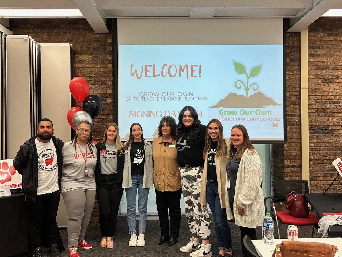 The very first cohort of Educational Assistants from the Westside Grow Our Own Program celebrate 'Signing Day' as they sign teacher contracts following the completion of the Teacher Career Ladder Program at Midland University