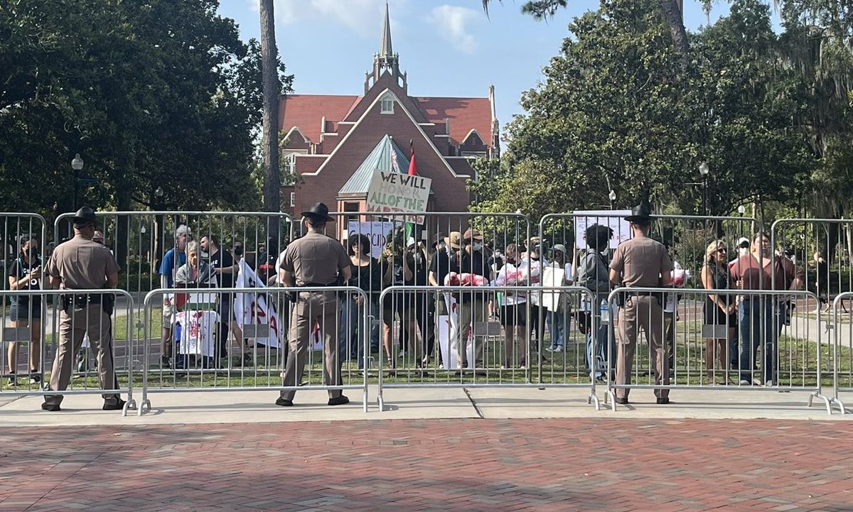 This is how you are allowed to protest a Desantis event in FL. Photo @AlexusGoings