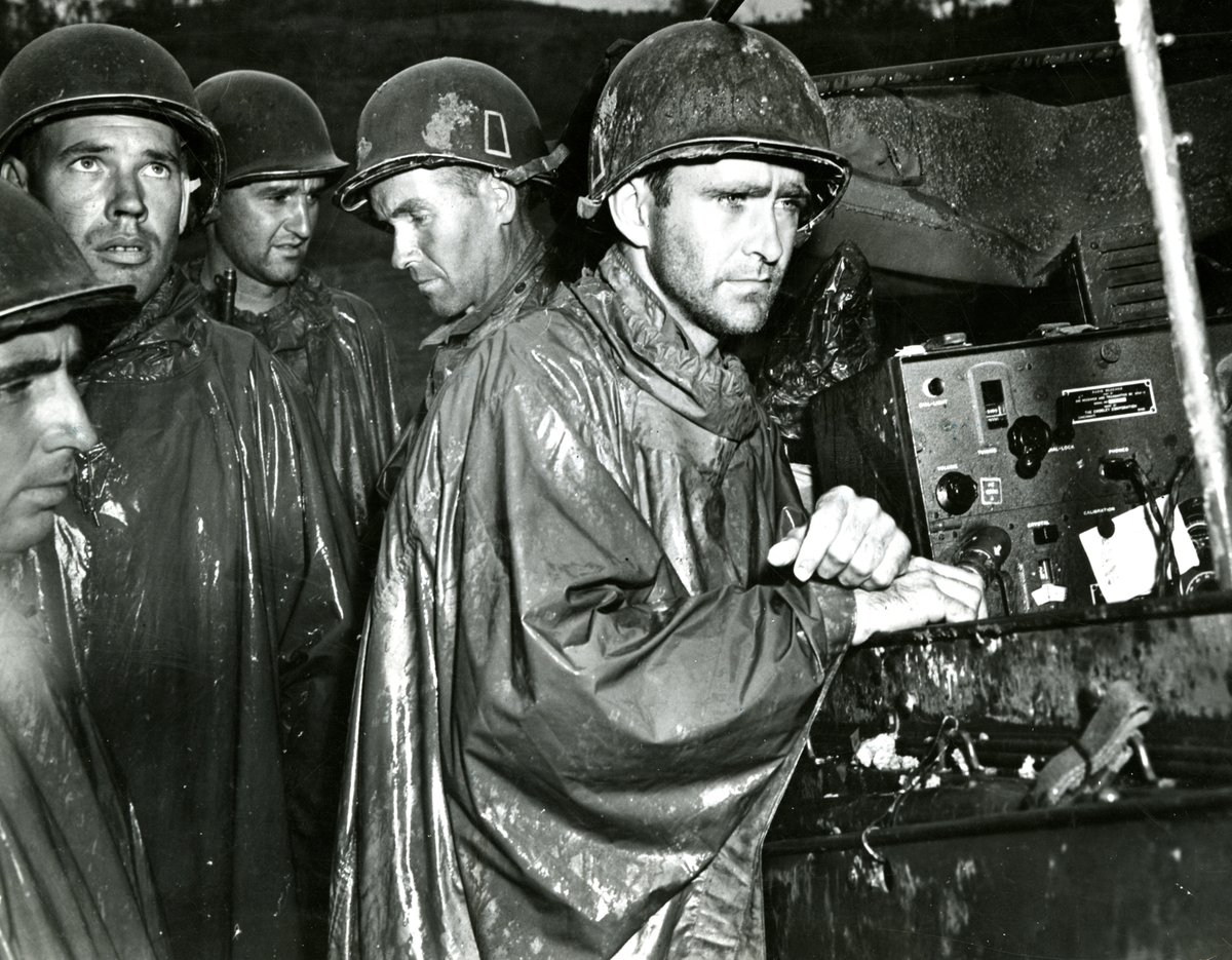 On May 8, 1945, Allied forces accepted the unconditional surrender of Germany. In this photo, men of the 77th Infantry Division on Okinawa listen to radio reports of victory half a world away. Explore more photos from V-E Day and World War II here: bit.ly/3QDMzG9
