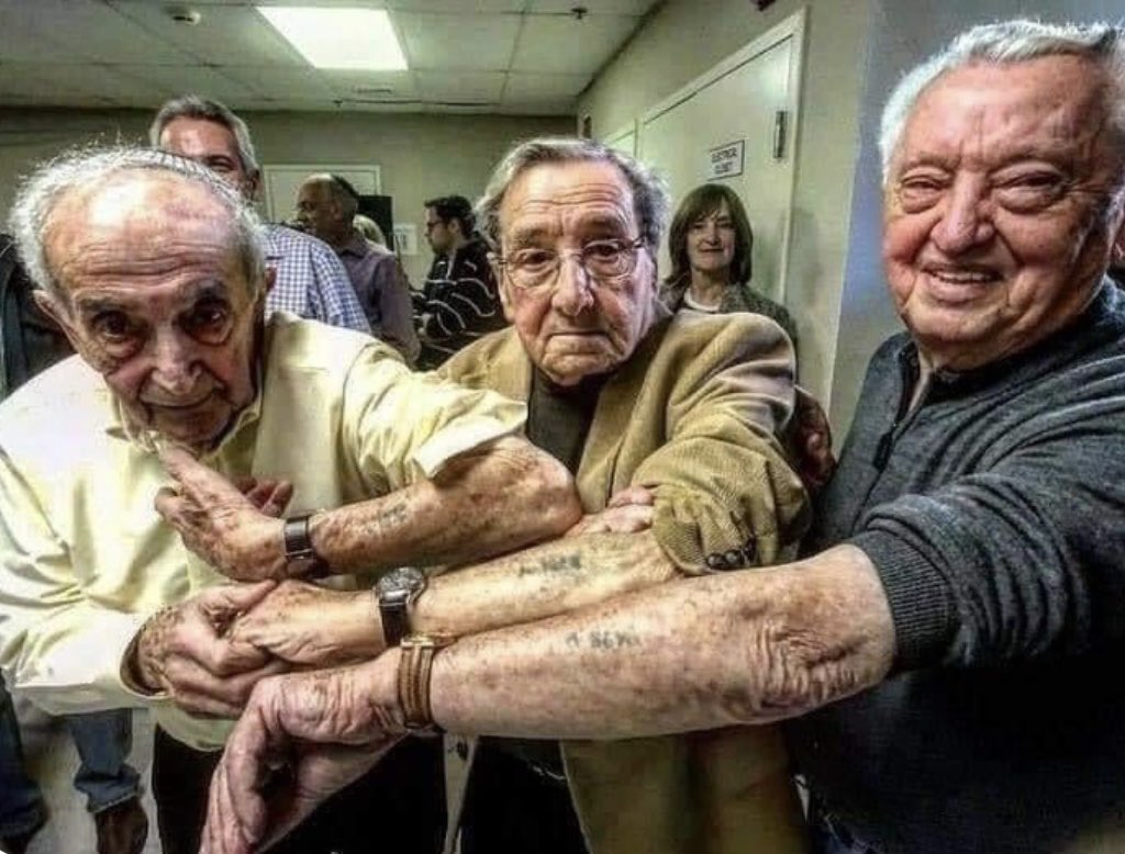 These three Jewish men arrived at Auschwitz on the same day and were tattooed with numbers that were only 10 digits apart. 73 years later, they encountered each other for the first time.